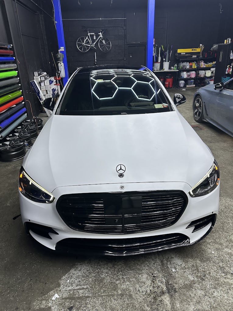 White Mercedes-Benz with freshly tinted glass